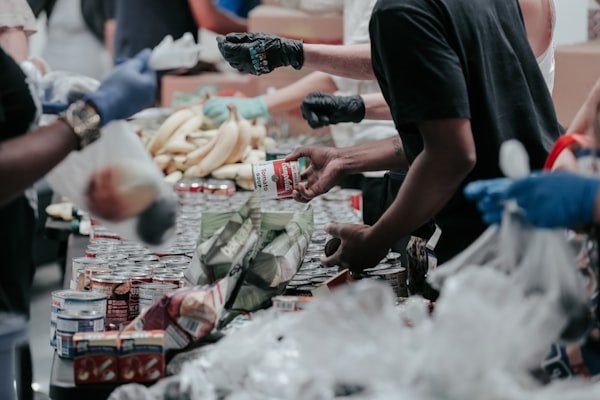 Volunteers distributing food and supplies during the Winter Relief Drive