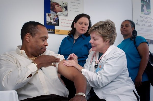Community health worker caring for a patient